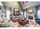 Spacious living room with a fireplace, high ceilings, and comfortable furniture at 3167 Blairhill Ct, Atlanta, GA 30340