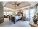 Spacious main bedroom with a ceiling fan, sitting area, and an abundance of natural light at 3167 Blairhill Ct, Atlanta, GA 30340
