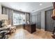 Spacious office featuring hardwood floors, a desk, and a large window at 3167 Blairhill Ct, Atlanta, GA 30340