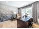 Bright office with dark wood desk, natural light, decorative wallpaper, and comfortable chair at 3167 Blairhill Ct, Atlanta, GA 30340