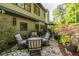 Relaxing patio with a seating area, greenery, and a stone-paved surface, ideal for outdoor enjoyment at 3167 Blairhill Ct, Atlanta, GA 30340
