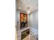 Elegant staircase with art, chandelier, and decorative ceiling feature, offering a stylish transition at 3167 Blairhill Ct, Atlanta, GA 30340