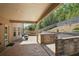 Covered back patio with brick pavers, retaining wall, and seating area at 3345 Palmer Lake Pointe, Douglasville, GA 30135