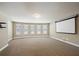 Spacious bonus room with projector screen and natural light from the many windows at 3345 Palmer Lake Pointe, Douglasville, GA 30135