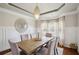 Elegant dining room featuring a modern light fixture and large windows at 3345 Palmer Lake Pointe, Douglasville, GA 30135