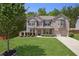 Beautiful brick two-story home with manicured lawn and attached two car garage at 3345 Palmer Lake Pointe, Douglasville, GA 30135