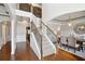 Grand foyer with staircase, hardwood floors, and elegant dining room with chandelier at 3345 Palmer Lake Pointe, Douglasville, GA 30135
