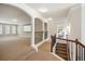 Second floor hallway with wood and metal railings and arched openings to other rooms at 3345 Palmer Lake Pointe, Douglasville, GA 30135
