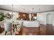 Modern kitchen featuring a dining area, stainless steel appliances, wooden cabinets, and hardwood flooring at 3345 Palmer Lake Pointe, Douglasville, GA 30135