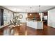 Open concept kitchen with granite counters, stainless appliances, and adjacent dining area at 3345 Palmer Lake Pointe, Douglasville, GA 30135