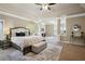 Large main bedroom boasts a tray ceiling, sitting area, and neutral tones at 3345 Palmer Lake Pointe, Douglasville, GA 30135
