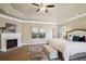 Beautiful main bedroom with tray ceilings, a fireplace, and a seating area at 3345 Palmer Lake Pointe, Douglasville, GA 30135