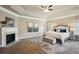 Spacious main bedroom featuring tray ceilings, a fireplace, and plush carpet at 3345 Palmer Lake Pointe, Douglasville, GA 30135
