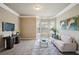 Cozy sitting area features plush seating, a large window, and elegant decor at 3345 Palmer Lake Pointe, Douglasville, GA 30135