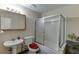 Traditional bathroom with a vanity sink, toilet, and enclosed shower-tub combination at 380 Chandler Ct, Sugar Hill, GA 30518