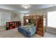Charming bedroom with wooden bunk beds, plush carpet, and delightful decor at 380 Chandler Ct, Sugar Hill, GA 30518