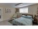 Cozy bedroom with a comfortable bed and soft, natural light at 380 Chandler Ct, Sugar Hill, GA 30518