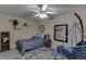 Stylish bedroom with a cozy bed, hanging chair, unique decor, and carpet at 380 Chandler Ct, Sugar Hill, GA 30518