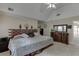 Spacious bedroom features a decorative headboard, large dresser, and stylish decor at 380 Chandler Ct, Sugar Hill, GA 30518