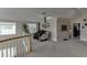 Expansive bonus room with exercise equipment, massage chairs, and plush carpet at 380 Chandler Ct, Sugar Hill, GA 30518