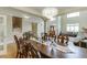 Elegant dining room with a view of the open floor plan, offering a seamless flow to the living space at 380 Chandler Ct, Sugar Hill, GA 30518