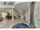 Elegant foyer featuring a grand entrance with a high ceiling, staircase, and a view into the dining area at 380 Chandler Ct, Sugar Hill, GA 30518