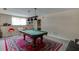 Basement game room featuring a pool table and ample space for entertaining at 380 Chandler Ct, Sugar Hill, GA 30518