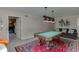 Versatile basement game room with a pool table and sofa at 380 Chandler Ct, Sugar Hill, GA 30518