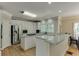 Bright kitchen featuring stainless steel appliances, granite countertops, and plenty of cabinet space at 380 Chandler Ct, Sugar Hill, GA 30518