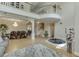 Bright living room with high ceilings, a view of the staircase, and a comfortable gray sectional sofa at 380 Chandler Ct, Sugar Hill, GA 30518
