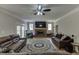 Living room with fireplace, hardwood floors, comfortable seating and natural light at 380 Chandler Ct, Sugar Hill, GA 30518