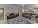 Comfortable living room with hardwood floors and open access to the kitchen at 380 Chandler Ct, Sugar Hill, GA 30518