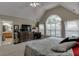 Spacious main bedroom with vaulted ceilings and an ensuite bathroom at 380 Chandler Ct, Sugar Hill, GA 30518