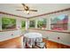 Bright breakfast nook with hardwood floors and natural light streaming through large windows at 426 College E St, Bowdon, GA 30108