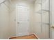 A closet featuring metal shelving, light colored walls, and a wood floor at 426 College E St, Bowdon, GA 30108
