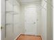 A closet featuring metal shelving, light colored walls, and a wood floor at 426 College E St, Bowdon, GA 30108