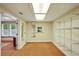 Spacious walk-in closet with shelving and a built-in mirror, next to carpeted room at 426 College E St, Bowdon, GA 30108