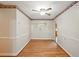A dining room with hardwood floors, neutral paint, and wainscoting at 426 College E St, Bowdon, GA 30108