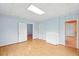 Spacious living room boasting wood floors, neutral paint and trim plus two entry ways at 426 College E St, Bowdon, GA 30108