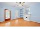 Inviting living space with wood floors, a fireplace, and light blue painted walls at 426 College E St, Bowdon, GA 30108