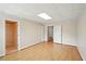 Spacious living room boasting wood floors, neutral paint and trim plus two entry ways at 426 College E St, Bowdon, GA 30108