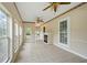 Sun-filled living room with tile floors, a fireplace, and a decorative ceiling fan at 426 College E St, Bowdon, GA 30108