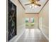 Hallway with tile flooring, paneled walls, and view of back yard at 426 College E St, Bowdon, GA 30108