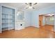 Light blue living room with wood floors, a decorative fireplace, and built-in shelves at 426 College E St, Bowdon, GA 30108
