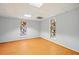Bright room with laminate flooring and two windows, offering a versatile space at 426 College E St, Bowdon, GA 30108