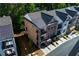 Aerial view of brick townhomes, highlighting the roofline and community layout at 451 Burton Dr # 32, Alpharetta, GA 30009