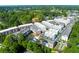 Overhead view of the community showcasing modern townhomes, mature trees, and a refreshing swimming pool at 451 Burton Dr # 32, Alpharetta, GA 30009