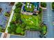 Aerial view of a rooftop putting green with seating area for entertaining, next to a parking deck at 451 Burton Dr # 32, Alpharetta, GA 30009