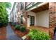 Private backyard brick patio with access to walking path and community space at 451 Burton Dr # 32, Alpharetta, GA 30009