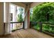 Private balcony provides a tranquil retreat with views of lush greenery, perfect for relaxation and enjoying nature at 451 Burton Dr # 32, Alpharetta, GA 30009